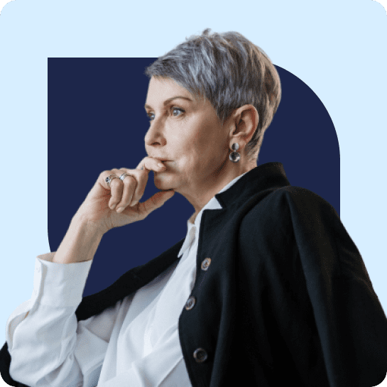 A woman with gray hair and a hand on her chin.