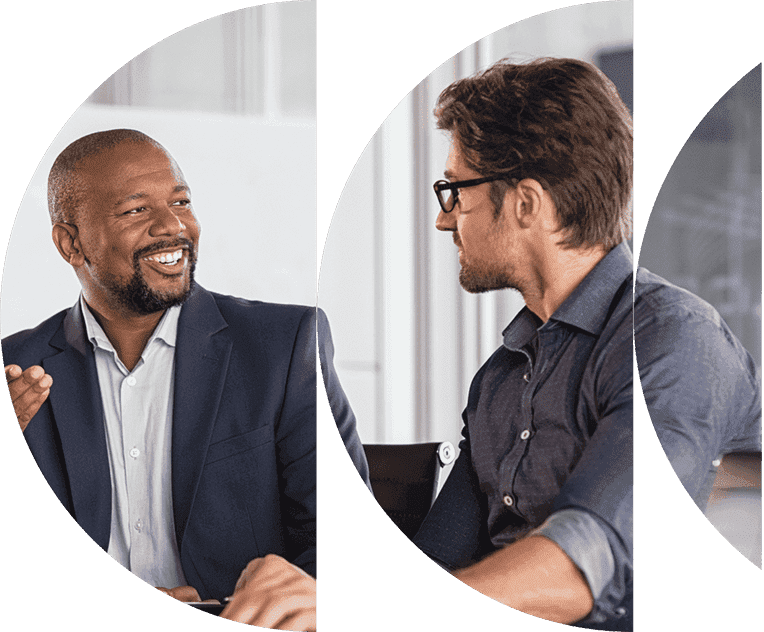 A group of business men talking in a circle.